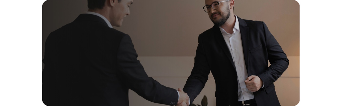 Two business people shaking hands